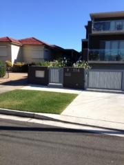 Automatic swinging driveway gates custom louvre design Sydney