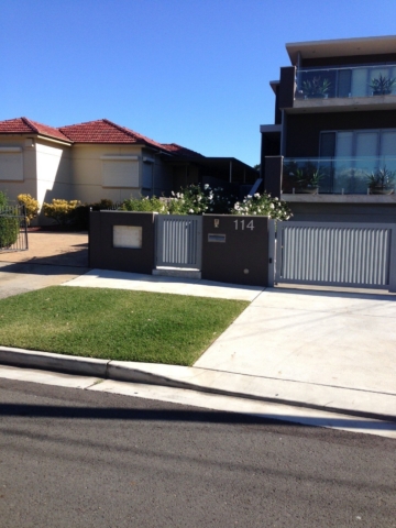 Automatic swinging driveway gates custom louvre design Sydney