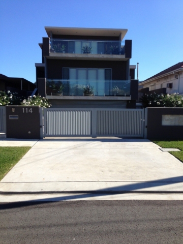 Automatic swinging driveway gates custom louvre design Sydney