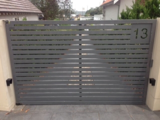 Automatic swinging driveway gates slats Sydney